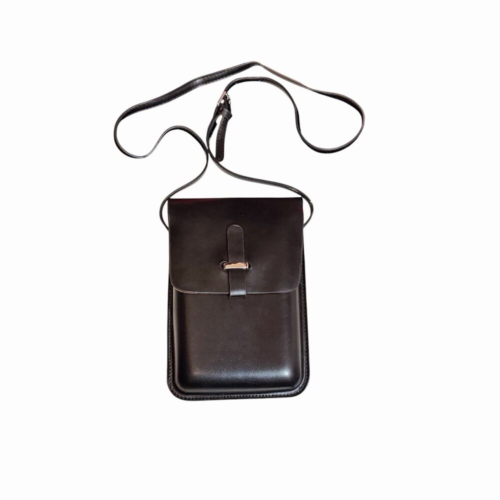 black faux leather shoulder bag with a slim silhouette and adjustable strap.